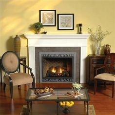 a living room filled with furniture and a fire place in the middle of a fireplace