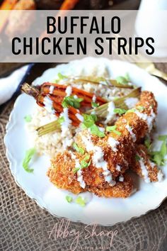 chicken fingers and rice on a white plate