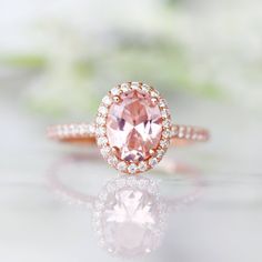 Beautiful Classic Morganite Halo Ring ►Base Metal: Sterling Silver (S925) ►Plating: 14K Rose Gold Vermeil ►Accented With Simulated Diamonds Main Stone: Morganite Stone Creation: Lab-Created Color: Peachy-Pink Stone Cut: Oval Gem size: 8.0 x 6.0 mm Carat Weight: 1.21 ct. Stone Origin: Russia ►Please be aware that plated jewelry can wear off over time, if this is a concern we would suggest going with the sterling silver or solid gold jewelry option. ►Solid gold morganite ring can be purchased at: Classic Morganite Diamond Ring For Wedding, Classic Morganite Diamond Wedding Ring, Classic Pink Halo Ring, Classic Rose Gold Morganite Wedding Ring, Classic Rose Gold Rings With Accent Stones, Elegant Blush Ring For Anniversary, Elegant Blush Rings For Anniversary, Classic Pink Halo Ring For Wedding, Blush Ring With Center Stone For Promise