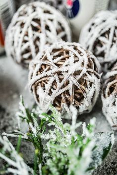 snow covered balls sitting on top of a table