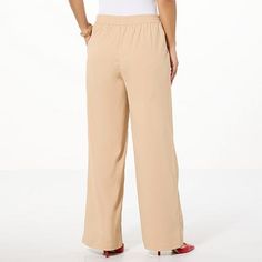 Jaclyn Smith Wide-Leg Pleated Trouser  Timelessly tailored yet always-at ease, these essential woven twill wide-leg pants are laid-back and comfortable yet refined and perfectly polished. For endless style options, dress them up or down with a blouse, sweater or graphic tee. Business Casual Wide Leg Pull-on Pants, Chic Beige Pull-on Style Pants, Classic Stretch Wide Leg Pants For Spring, Chic Solid Color Wide Leg Pants With Elastic Waistband, Chic Pull-on Pants For Daywear, Solid Color Wide Leg Pants With Relaxed Fit, Casual Wide Leg Pull-on Pants For Business, Elegant Wide Leg Pants With Pull-on Style For Fall, Chic Wide Leg Pants With Elastic Waistband For Daywear