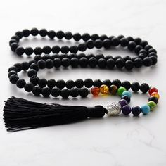 "Chakra 7 Black Lava Stone Mala 108 Necklace | Hand Knotted Mala Beads Necklace | Handmade Jewellery for Woman  You will receive: ⭐️ 1 x Handmade Chakra 7 Black Lava Stone Mala 108 Necklace  ⭐️ 100% Money Back Guarantee ⭐️ Free Shipping: US & Worldwide -  8mm Chakra 7 Black Lava Stone  -  Necklace length: 39-41inch -  Necklace weight: 120g - Tassel Length: 4.7inch Chakras are thought to provide subtle energy that helps your organs, mind, and intellect work at their best level. Chakras and spirit Spiritual Black Beads For Jewelry Making, Spiritual Black Beaded Necklaces With Round Beads, Black Spiritual Beaded Necklace With Round Beads, Black Bohemian Beaded Bracelets For Meditation, Adjustable Black Beaded Necklaces With 8mm Beads, Handmade Black Mala As Gift, Black Bohemian Mala With Round Beads, Bohemian Black Mala With Round Beads, Black Bohemian Round Beads