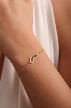 ✨ Made of 925 Sterling Silver  and Solid Gold Materials✨ 💕 Dainty Name bracelets are really trendy. An elegant piece to have in your collection. 🎄 Gold Name Bracelet will be a great gift for your loved ones. 🌙Perfect gift for Mothers Day Personalized 14k Gold Name Bracelet is the most favorite choice of recent times. Named Gold Bracelet is carefully handcrafted by our very experienced craftsmen. Name Bracelet is an elegant jewel. Name Signature Bracelet can really make your loved ones emotional. You can choose it as a Mothers Day Gift for your mom. Made of 100% 925 Sterling Silver. We can prepare 8k - 14k - 18k Solid Gold or Silver according to your preference. Personalized 14k Gold Box Chain Name Bracelet,  Custom Name Bracelet, Valentine Day Gifts for Her, Handmade Gift for Mom, Mothe Mom Bracelet Personalized, Name Bracelet Gold, Handmade Gift For Mom, Gold Name Bracelet, Bracelet Valentines, Signature Bracelet, Bridemaids Gifts, Moms Bracelet, Special Necklace