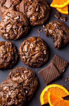 chocolate cookies and orange slices on a table