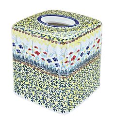 an artisticly designed tissue box with flowers on it