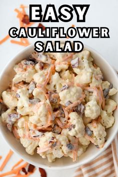 a bowl filled with cauliflower salad on top of a table