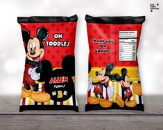 two bags of mickey mouse snacks on a table