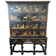 an ornate painted cabinet with animals on it