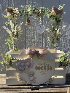 a wooden box with some plants in it and a sign that says we can do it