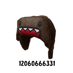 an image of a brown hat with red teeth and fangs on it's face