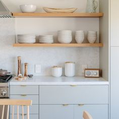 the kitchen is clean and ready to be used for cooking or baking, while also being used as a dining room