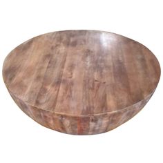 a round wooden table on a white background