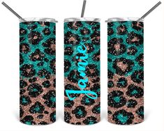 two green and black leopard print tumblers with straws in them on a white background