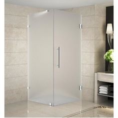 a corner shower stall in a bathroom with beige tile walls and flooring on the wall