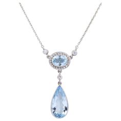 This aquamarine necklace whilst not of any great age has been crafted from quality stones and entirely set in platinum and 18 karat white gold. The necklace centres on two aquamarines, one oval cut, the other pear cut, each a medium light blue with slight inclusions. The aquamarines are accented with round brilliant cut diamonds which are each of G/H colour and VS-SI1 clarity totalling 0.60 carat. The platinum pendant is connected to a fine platinum chain which terminates with an 18 karat white Platinum Jewelry Necklaces, Platinum Pendant, Art Deco Pendant Necklace, Art Nouveau Necklaces, Fan Necklace, Platinum Chain, Art Nouveau Pendant, Bolt Ring, Pearl And Diamond Necklace