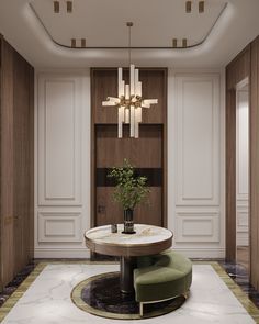 an elegant dining room with white walls and marble flooring, round table surrounded by green chairs