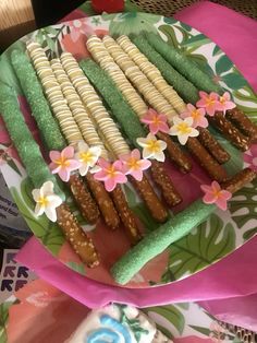 some food is laying out on a plate with flowers and other things to eat in the background