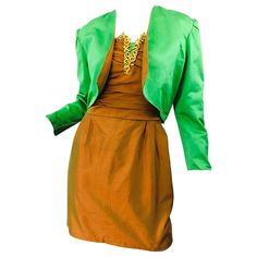 Beautiful 1990s orange metallic strapless dress and matching reversible cropped bolero jacket! Strapless mini dress features a fitted bodice with a forgiving skirt. Gold embroidery along the bust with a pop of green at center bust to match the bolero. Hidden zipper up the back with hook-and-eye closure. Couture quality, with the majority of the craftmanship completed by hand. Both pieces great together or as separates. In great condition. Approximately Size US Small / Small Medium Measurements: French Lace Dress, Dress Bolero, Cocktail Skirts, Blue Halter Dress, Ball Skirt, Bolero Dress, High Waisted Maxi Skirt, 1960's Dress, 1940s Dresses