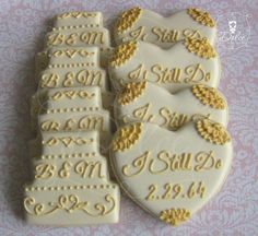 two cookies decorated with wedding date and names