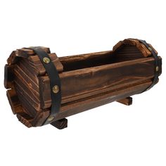 an old wooden barrel with metal straps on it's sides and the bottom section is made out of wood