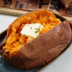 a baked sweet potato with butter and chives