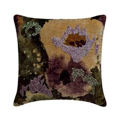 a decorative pillow with purple and green designs on it