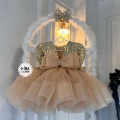 "Gold Tutu Baby Wedding Girl Dress"  Your little princess deserves to shine on her special day! 🎀✨ Dress her up in this adorable Gold Tutu Baby Wedding Girl Dress and watch her steal the show! 💖👑 🌟 Features: 🎀 Soft and breathable fabric for maximum comfort 💎 Delicate lace detailing for an elegant touch 👗 Fluffy pink tutu skirt for a dreamy look 🌸 Cute bow embellishments for added charm Whether she's a flower girl or attending a wedding, this enchanting dress will make her feel like a fai Princess Style Dress, Bow Embellishments, Pink Tutu Skirt, Ribbon Tutu, Enchanting Dress, Gold Tutu, Puffy Dresses, Dress Bow, Wedding Girl