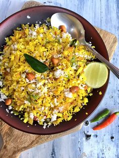 a brown bowl filled with rice and vegetables