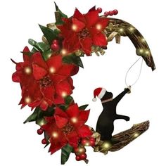 a christmas wreath with poinsettis and lights hanging from it's sides