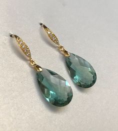 "Green Amethyst gold earrings. Pave vermail earwires. Pale mint. Statement jewelry. Gemstone jewelry. February birthstone. Faceted teardrop Light green Amethyst Stones. Choose from two options: 1) both gems are 19.2 carats. Length of the earrings 1 5/8\". As photo. Sold. 2) both 35 carats, each gem is 25 x 15 mm. Length is appropriately 1 1/2\". These Earrings will arrive in the beautiful jewelry box that I do for gift giving." Elegant Faceted Green Amethyst Jewelry, Green Drop Jewelry With Gemstone Accents, Green Teardrop Earrings With Gemstone Accents, Elegant Green Amethyst Earrings For Formal Occasions, Green Briolette Earrings For Wedding, Green Faceted Earrings For Wedding, Elegant Faceted Green Amethyst Earrings, Elegant Faceted Earrings For May Birthstone, Elegant Gold Earrings With Green Amethyst