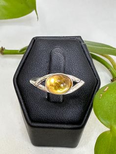 Sterling silver golden citrine ring. This stone is oval shape in a bezel setting. Oval Yellow Citrine Birthstone Ring, Oval Citrine Birthstone Ring, Yellow Oval Crystal Gemstone Ring, Yellow Oval Crystal Ring With Gemstone, Classic Oval Citrine Rings, Yellow Oval Topaz Rings, Yellow Citrine Oval Rings, Yellow Oval Topaz Ring Hallmarked, Oval Citrine Crystal Ring With Birthstone