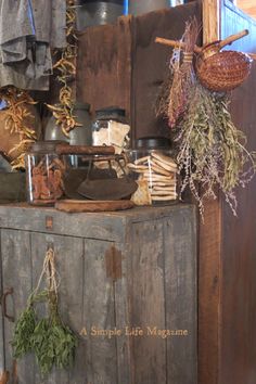 an old wooden cabinet with various items on it