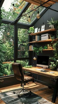 a home office with lots of greenery in the window sill and wooden flooring