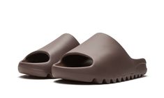 The adidas Yeezy Slide “Soot” is an easy-on, easy-off footwear option dressed in an earthy brown hue.  Dubbed “Soot,” this Yeezy Slide is a Fall 2020 release that displays a futuristic appearance.  Built entirely of lightweight yet durable EVA foam, the sandal features a midfoot arch that stabilizes the foot.  The ridged outsole provides grip on slippery surfaces.  Release date: September 4, 2020. Meds For Dogs, Adidas Shoes Yeezy, Shark Shoes, Adidas Yeezy Slide, Yeezy Slides, Jewelry Fashion Trends, Dream Shoes, Adidas Yeezy, Kanye West