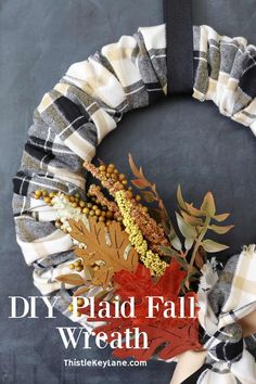 a fall wreath made with plaid fabric and dried leaves on the front door for an easy diy project