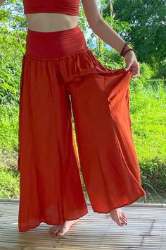 Long flowy Persephone Palazzo Pants come in one size, fits sizes 0-14. Soft stretchy viscose waist band can be worn high or folded over. Pull string around hips created snug fit for smaller body sizes. Available in Onyx, Sage and Rust. Ethically handmade of tree pulp eco Lyocell fabric its silky, luxurious and stunning, also known as vegan silk. Matching Bell Sleeve Lily Tops, Halter Tops, and Tube Tops make gorgeous eco outfits. Mix and match styles and colors. Stretch Summer Harem Pants, Spring Harem Yoga Pants With Elastic Waistband, Solid Full-length Summer Yoga Pants, Versatile Summer Yoga Pants With Elastic Waistband, High Waist Solid Color Yoga Pants For Summer, Stretch Harem Pants For Festivals, Stretch Harem Pants For Summer, Solid Wide-leg Summer Yoga Pants, Summer Wide-leg Yoga Pants