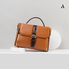 Cipatujuh Bag, Genuine Premium Cow Leather Women's Bag, Luxurious and Elegant Women's Bag, Stylish and Cool Women's Bag, Handmade Bag 📌 Made from 100% natural premium leather with orange peel texture.   📌Has a living room with a large capacity.   📌Exclusive design.   📌Comfortable to use every day.   📌Handle is strong and sturdy. 📌 The stitching details are very neat.   📌Has a secret space at the back of the bag to store notes or other small items.   📌Because it is made from 100% premium leather, this bag has been proven to be water and fire resistant.   📌Using a metal zipper so it is not easily damaged and items will be stored more safely.   📌Adjustable long strap. 📌Size details 📌Pamela bag size ✅P 26 ✅T 18 ✅L 10 📌Color: Tan, Black, Brown, Maroon   📌EXCLUSIVE STNK STICK WALLE Brown Handheld Bag With Top Carry Handle, Cognac Handheld Bag With Detachable Handle, Brown Handheld Box Bag For Daily Use, Vintage Rectangular Flap Bag With Detachable Handle, Brown Handheld Satchel, Handheld Brown Satchel For Office, Brown Handheld Satchel With Detachable Handle, Brown Handheld Satchel For Office, Brown Handheld Office Satchel