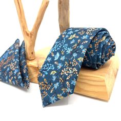 "Flower Navy Blue Neck Ties / Wedding Neck Ties / Mens Necktie / Groomsmen Necktie / Pocket Square Set / Neck Tie For Men/ Neck Tie This navy blue tie has a unique style with floral patterns of various colors on it. It is a unique handmade tie that you can only find on this page. You can either gift this hand-made Flower Navy Neck Ties or you can use it yourself to feel different on your special days. Please include your size option for the bow tie in your order notes. Otherwise, Adult size will Blue Ties For Father's Day, Blue Ties With Pocket Square For Wedding, Dapper Blue Ties For Groom, Dapper Ties For Groom On Father's Day, Blue Suit And Tie Accessories For Groom, Groom Ties For Father's Day, Blue Ties And Pocket Square For Groom, Blue Tie With Pocket Square For Groom, Blue Groom Suit Accessories With Pocket Square