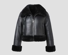 This black leather shearling jacket for women is not only stylish but also practical, making it perfect for various occasions. The high-quality leather, coupled with the plush shearling collar and cuffs, adds a luxurious touch. Stay warm and cozy in cold weather with the soft shearling lining. Whether it's a special event or a chilly day, this jacket combines fashion and functionality effortlessly. Features: * Made from high-quality leather * Luxurious shearling collar and cuffs * Soft shearling lining * Zipper closure * Two front pockets * One interior pocket How to style: Casual: Pair the jacket with jeans, a t-shirt, and sneakers for a casual and effortless look. Dressed-up: Pair the jacket with a black dress and heels for a more dressed-up look. Guarantee: This jacket is backed by our Leather Shearling Jacket, Leather Coat With Fur, Leather Jacket With Fur, Classic Wardrobe Essentials, Winter Leather Jackets, Jacket With Fur, Fur Leather Jacket, Sheepskin Coat, Black Aviators