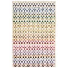 a multicolored rug with circles and dots in different colors on the bottom half