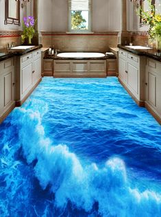 a bathroom with blue water flooring that looks like it is floating in the ocean