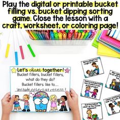 two hands holding up a printable game for kids to play with crayons and colored pencils