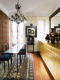 the dining room is clean and ready for us to eat dinner on it's long table