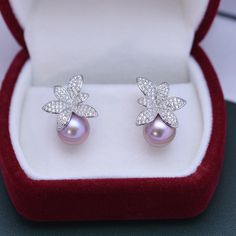 9-10mm Purple Freshwater Pearl & Floral Stud Earrings #pearls #pearllovers #pearlsforgirls #goldensouthseapearls #PearlNecklace #pearlsdaily #Akoyapearls #pearlsaregirlsbestfriend #realpearls #jewelrygram Elegant Pink Cubic Zirconia Flower Earrings, Elegant Purple Pearl Earrings For Anniversary, Elegant Pink Flower Earrings, Elegant Silver Pearl Flower Earrings, Elegant Purple Flower Earrings For Party, Elegant Purple Pearl Earrings For Formal Occasions, Elegant Sterling Silver Pearl Earrings In Flower Shape, Elegant Flower-shaped Sterling Silver Pearl Earrings, Elegant Purple Pearl Earrings