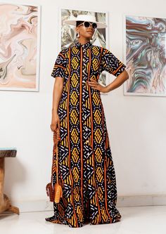 This sophisticated unlined kaftan with yellow & black colors of traditional African ankara fabric, is that stately piece you need to make a grand impression! The kaftan can be worn as evening wear to various events such as weddings, dinner parties and other formal occasions. Long Kaftan Dress African, Free Size Batik Print Maxi Dress, Black Printed Short Sleeve Maxi Dress, Black Printed Maxi Dress With Short Sleeves, Printed Free Size Maxi Dress With Short Sleeves, Black Maxi Dress With Batik Print, Vibrant Print Long Maxi Dress, Printed Tunic Maxi Dress For Festivals, Festival Tunic Maxi Dress Printed