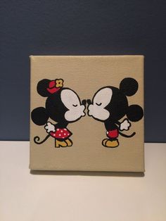 a painting of mickey and minnie kissing each other