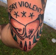 a man with a tattoo on his leg that says stay violent and two hands holding each other