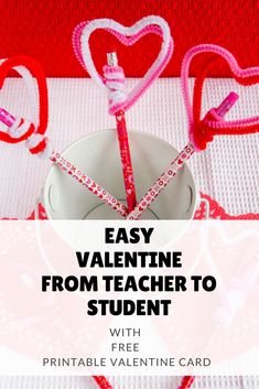 valentine's day card with two heart shaped pencils in front of it and the words easy valentine from teacher to student