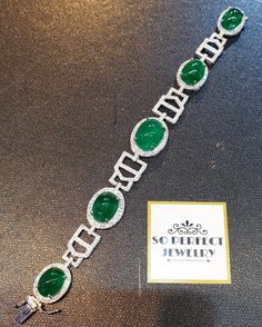 "A DREAM COMES TRUE! Gorgeous masterpiece! ONE OF A KIND Bracelet! Featuring 7 pieces of extra fine GLOWING VIVID GREEN Zambian Emerald weighting a total of 58.94 carats... and 334 pieces of SUPER SPARKLING, top-grade, F/VS Diamonds (4.01 carat in total). SET IN ONE-OF-A-KIND 18K Solid White Gold, meticulously designed and handcrafted BRACELET! A true heirloom piece that can transcend beyond times and eras.... JUST FINISHED, HANDMADE BY OUR GOLDSMITHS! DAZZLING GENUINE EMERALDS! Extremely rare, Silver Emerald Tennis Bracelet For Formal Occasions, Formal Silver Tennis Bracelet With Emeralds, Formal Silver Emerald Tennis Bracelet, Luxury Silver Tennis Bracelet With Emeralds, Elegant Silver Tennis Bracelet With Emeralds, Elegant Silver Emerald Tennis Bracelet, Formal Silver Diamond Bracelet With Emeralds, Luxury Silver Bracelets With Cabochon, Luxury Round Emerald Bracelets