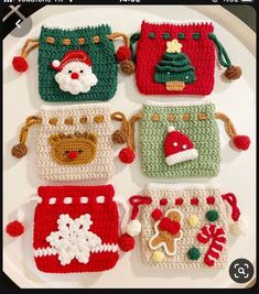 four crocheted christmas purses on a plate